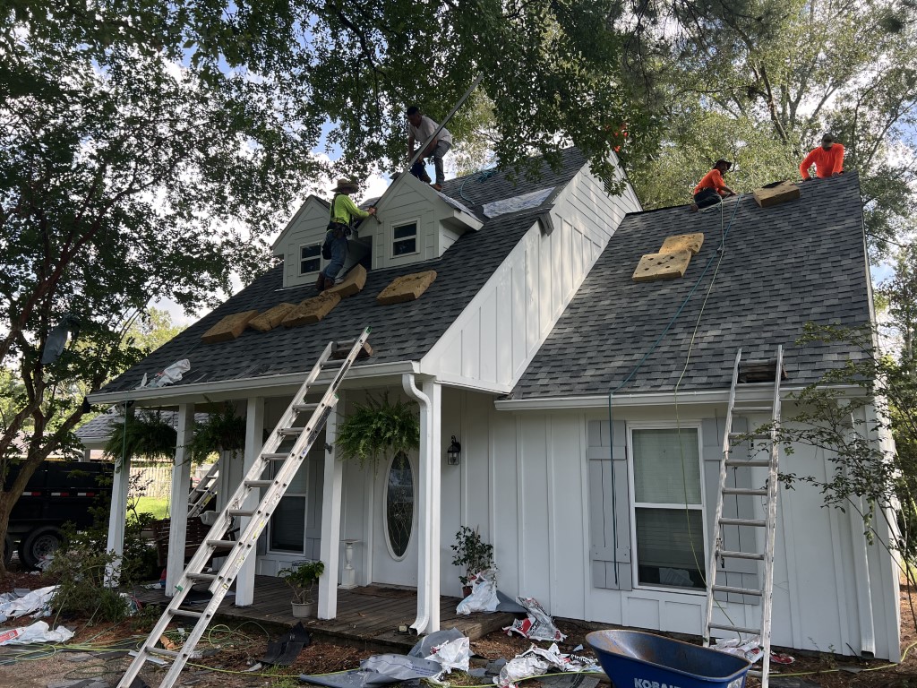 Roofing work beneath tree shade