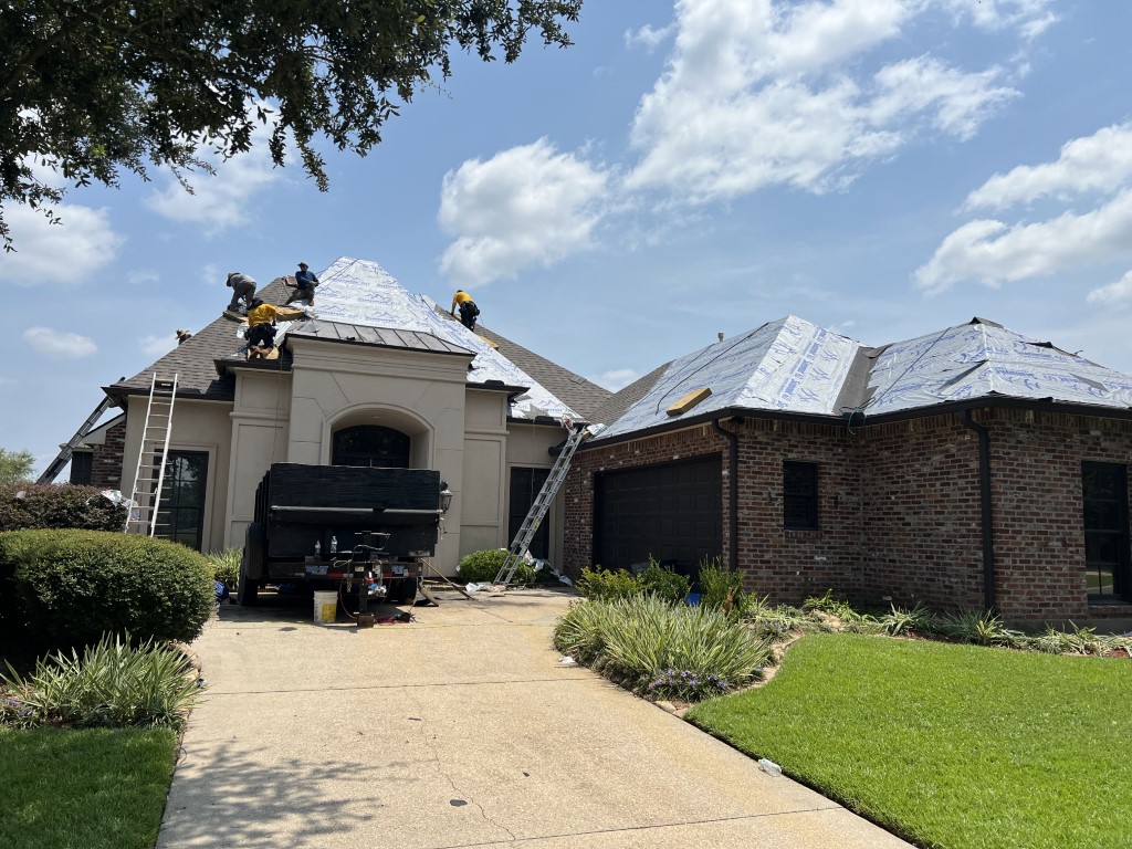 Roof underlayment installation on brick home